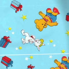 Papel de regalo azul claro liso con conejos y osos